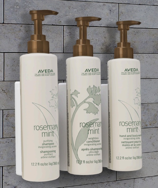 Aveda wall-mounted dispensers installed in a Summit Hospitality bathroom